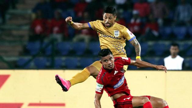 Players of North East United FC and Mumbai City FC in action during their Indian Super League (ISL) football match at Indira Gandhi Atheletic Stadium in Guwahati, Wednesday, Nov. 27, 2019. (PTI) Players of North East United FC and Mumbai City FC in action during their Indian Super League (ISL) football match at Indira Gandhi Atheletic Stadium in Guwahati, Wednesday, Nov. 27, 2019. (PTI)