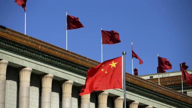 Chinese flag waves in front of the Great Hall of the People in Beijing.(Reuters) Chinese flag waves in front of the Great Hall of the People in Beijing.(Reuters)