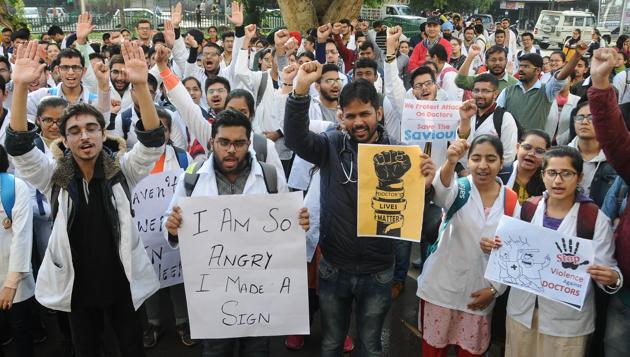 Junior doctors protesting at the Government Rajindra Hospital in Patiala on Wednesday. They are demanding strict action against the accused and a safe work environment.(HT PHOTO)
