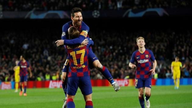 Barcelona's Antoine Griezmann celebrates scoring their third goal with Lionel Messi(REUTERS)