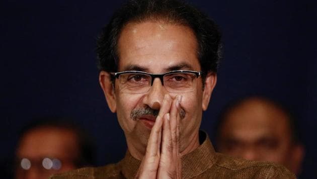 Shiv Sena chief Uddhav Thackeray greets people after arriving at a press conference with Nationalist Congress Party president Sharad Pawar in Mumbai.(Photo: Reuters)