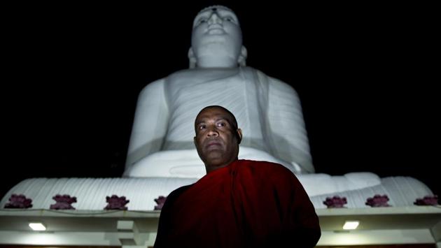 Yatawatte Dhammananda, a monk and Bodu Bala Sena organizer, outside a Buddhist temple in Kandy. “They have the intention of making this a Muslim country. They are working toward that, but we can’t let that happen,” said Dhammananda. “This is a fast-vanishing race in the world,” he said of Sinhalese Buddhists. “It is our duty to protect it.” (Dar Yasin / AP)