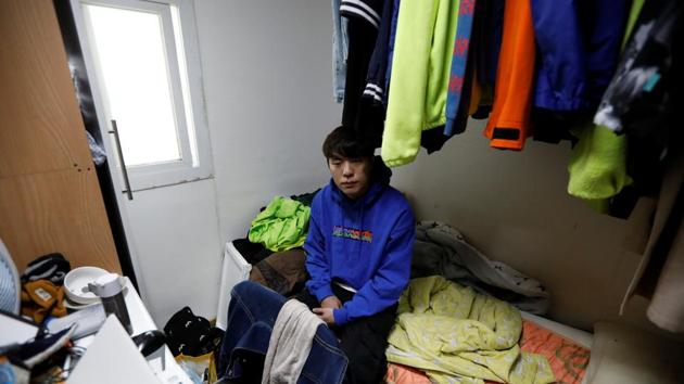 Hwang Hyeon-dong in his 6.6-square-metre cubicle, called a goshi-won near his university campus which comes with a shared bathroom and kitchen plus all the rice he can eat, that he rents for 350,000 won ($302) a month. Cubicles are increasingly becoming permanent homes to young people like Hwang, who identifies himself among the “dirt spoons”, those born to low-income families who have all but given up on social mobility. (Kim Hong-Ji / REUTERS)