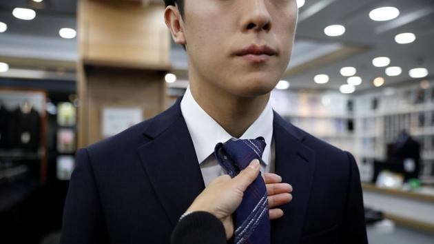 Hwang and his mother shop for a suit ahead of a job interview in Guri. To many struggling youth, the scandal - which fuelled some of the largest protests of Moon’s term - showed how gold spoons get further ahead with the help of their parents’ status and wealth. In a September poll of 3,289 people by recruiting service provider Saramin, three-quarters of respondents said parents’ background was key to children’s success. (Kim Hong-Ji / REUTERS)