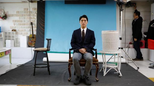 Hwang Hyeon-dong poses for photographs which will be used for his resume. Support among voters aged 19 to 29 dropped from 90% in June 2017 to 44% by October, according to a poll by Gallup Korea.“President Moon’s been talking about equal opportunity, a level-playing field and justice. But, I feel a sense of betrayal because the current situation is far different from what he promised,” said Hwang, who voted for Moon. (Kim Hong-Ji / REUTERS)