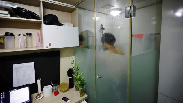 Kim Jae-hoon takes a shower before going to bed in his cubicle. A popular fantasy digital cartoon called “Golden Spoon” featuring a poor boy swapping his family with his rich friend’s by eating with a magic gold spoon is set to be serialized as a TV drama. Gold spoons are now a hot gift item, replacing gold rings traditionally given to children on their first birthdays, wishing them a wealthy life. (Kim Hong-Ji / REUTERS)