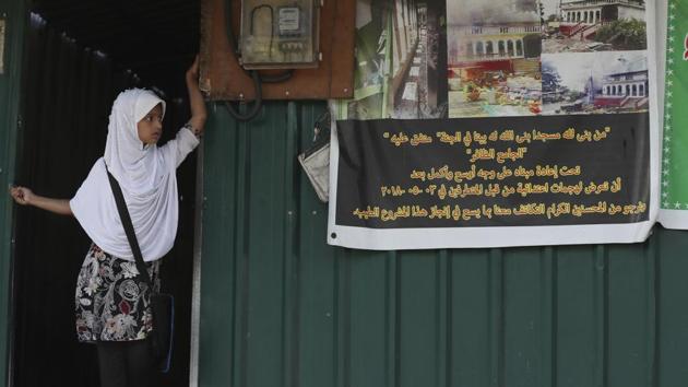A young Muslim girl stands at the entrance of a temporary mosque. “Halal, burqa, Islamic banks, Kathi courts, Shariah universities, those all destroyed social integrity that we do have,” Gnanasara said in an interview. “Gotabaya can establish one rule, one nation, one country.” At his swearing-in earlier this month, Rajapaksa said he would be president for all Sri Lankans. (Dar Yasin / AP)