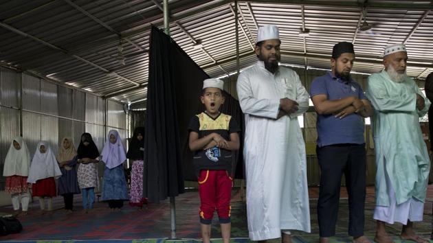 Muslims offer prayers inside a temporary mosque in the outskirts of Kandy. Outside recent Friday prayers at the 500-year-old Grand Mosque of Colombo, businessman M.S.M. Zaneer said antagonism against the country’s Muslims wasn’t new, but it had grown more virulent. He said worshippers lived in fear of a repeat of violence in which Buddhists have looted and set fire to mosques. “I can say they are terrorists as well,” he said. (Dar Yasin / AP)