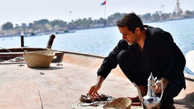Abdullah al-Suwaidi open oysters to look for pearls. The pearl industry once underpinned the economy of the UAE but the trade collapsed in the 1930s with the advent of Japanese cultured pearls and as global conflicts made them an unaffordable luxury. While Suwaidi does sell his pearls to local and international designers, he says the venture is not merely aimed at making money. (Guiseppe Cacace / AFP) 