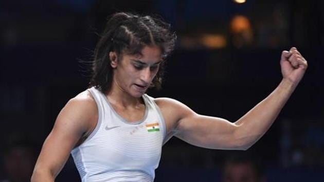 Vinesh Phogat of India reacts as she won the bronze match of the women's 53kg category.(AP)