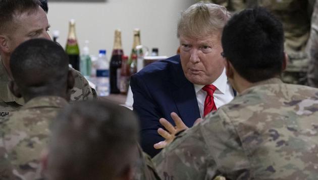 US President Donald Trump speaking to members of the military in a dining facility during a surprise Thanksgiving Day visit, Thursday, Nov. 28, 2019, at Bagram Air Field, Afghanistan.(AP)
