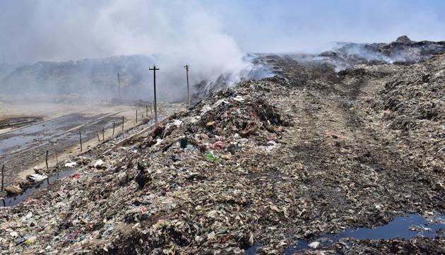 Over 24 lakh metric tonnes of garbage has accumulated at the main dump site on the Tejpur Road in Ludhiana and fire incidents are common at the site.(Gurpreet Singh/Hindustan Times)