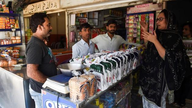 Bebo Haider (R) speaks with Mohammad Akram (L). “Whenever she sees us, she greets us with a good heart and she meets with everybody pleasantly,” said Akram, the 40-year-old owner of a milk shop next to the salon. “We are not concerned with what their gender is,” he added. Haider and other activists helping her hope the salon is just the first step on the road to economic empowerment for their community. (Rizwan Tabassum / AFP) Bebo Haider (R) speaks with Mohammad Akram (L). “Whenever she sees us, she greets us with a good heart and she meets with everybody pleasantly,” said Akram, the 40-year-old owner of a milk shop next to the salon. “We are not concerned with what their gender is,” he added. Haider and other activists helping her hope the salon is just the first step on the road to economic empowerment for their community. (Rizwan Tabassum / AFP)