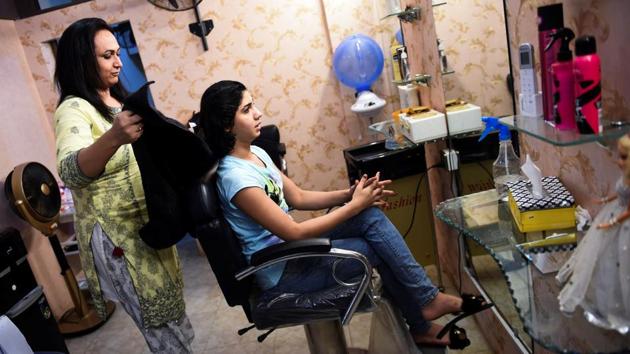 “When we would sit along the ladies at the parlour, they would feel nervous, confused and even feel repulsive of us. (But) we are also human beings,” said Mahi Doll, a 21-year client of Tarawah. Judged, harassed or even denied entry at other salons, Tarawah Doll says, is more than just a safe space for customers to get their hair and make-up done. “This is a symbol of transgender empowerment,” she said. (Rizwan Tabassum / AFP) “When we would sit along the ladies at the parlour, they would feel nervous, confused and even feel repulsive of us. (But) we are also human beings,” said Mahi Doll, a 21-year client of Tarawah. Judged, harassed or even denied entry at other salons, Tarawah Doll says, is more than just a safe space for customers to get their hair and make-up done. “This is a symbol of transgender empowerment,” she said. (Rizwan Tabassum / AFP)