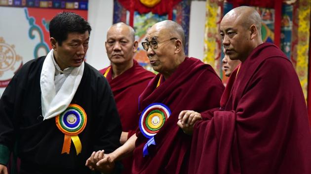 Tibetan spiritual leader The Dalai Lama arrives to attend a conference at CTA block in Mcleodganj on Friday.(ANI PHOTO)