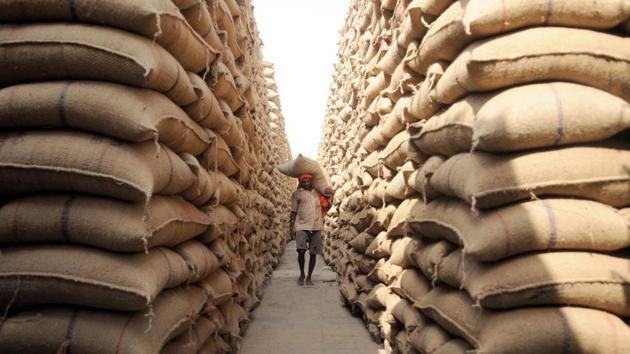 Workers carry wheat sacks at a godown in Jalandhar, Punjab. “The area under wheat and yields would rise due to good rainfall. We can certainly produce more than last year’s record production,” said Gyanendra Singh, director at the state-run Indian Institute of Wheat and Barley Research. (Pardeep Pandit / HT Archive) Workers carry wheat sacks at a godown in Jalandhar, Punjab. “The area under wheat and yields would rise due to good rainfall. We can certainly produce more than last year’s record production,” said Gyanendra Singh, director at the state-run Indian Institute of Wheat and Barley Research. (Pardeep Pandit / HT Archive)