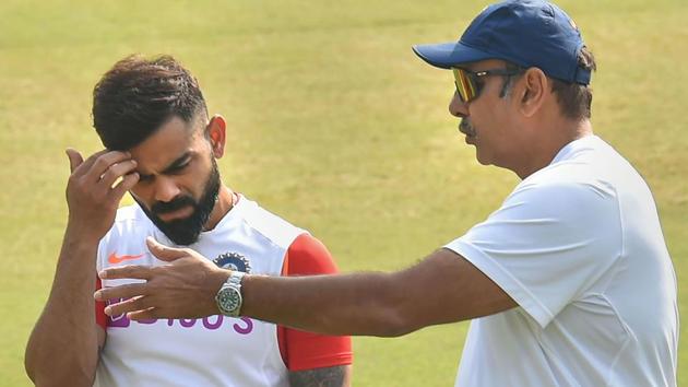 Indian cricket captain Virat Kohli talks with Head Coach Ravi Shastri.(PTI)