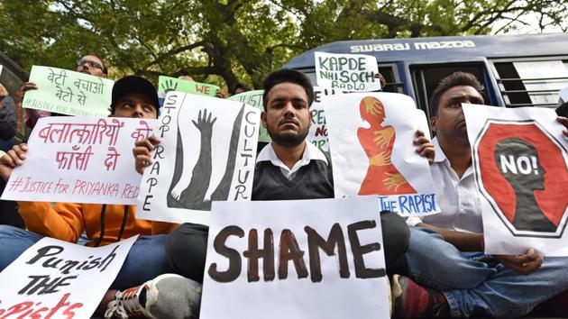 Students from different organisations hold placards to protest against the Telangana government after a rape case of a veterinary doctor in Hyderabad at Parliament Street in New Delhi. (Sanchit Khanna/HT PHOTO) Students from different organisations hold placards to protest against the Telangana government after a rape case of a veterinary doctor in Hyderabad at Parliament Street in New Delhi. (Sanchit Khanna/HT PHOTO)