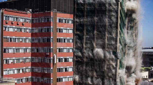 The Bank of Lisbon building implodes in Johannesburg, South Africa. Johannesburg CBD’s iconic Bank of Lisbon building has been demolished after it was deemed structurally unfit following a 2018’s fire which lasted three days and claimed the lives of three firefighters. (Michele Spatari / AFP)