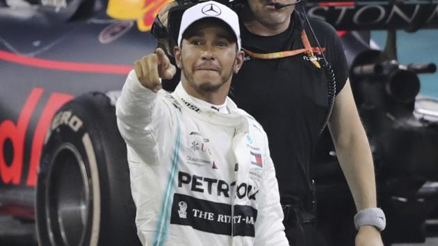 Lewis Hamilton of Britain celebrates after winning the Abu Dhabi Grand Prix.(AP)