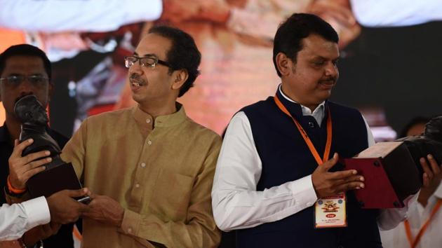 Maharashtra CM Devendra Fadnavis and Shiv Sena Chief Uddhav Thackeray during 86th birth anniversary of Late Mathadi Leader AnnaSaheb Patil at APMC Onion Potato Market Vashi in Navi Mumbai. (Bachchan Kumar/ Hindustan Times) Maharashtra CM Devendra Fadnavis and Shiv Sena Chief Uddhav Thackeray during 86th birth anniversary of Late Mathadi Leader AnnaSaheb Patil at APMC Onion Potato Market Vashi in Navi Mumbai. (Bachchan Kumar/ Hindustan Times)