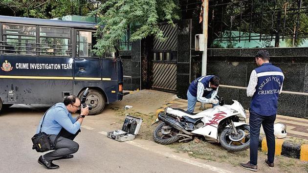 A crime scene photographer at work in New Delhi on Sunday. (Sourced) A crime scene photographer at work in New Delhi on Sunday. (Sourced)