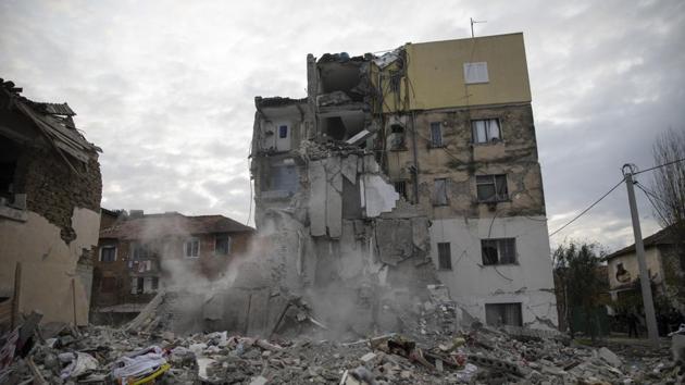 Dust rises from the falling parts of a destroyed building during an aftershock in Thumane, western Albania. The 6.4-magnitude quake that hit Albania’s Adriatic coast before dawn on Tuesday last week has left at least 51 people dead, around 2,000 others injured and about 4,000 people homeless. (Petros Giannakouris / AP)