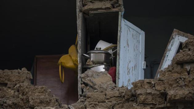 Saucepans stacked inside a kitchen cupboard of a damaged house in Thumane. After the first day, rescuers were finding more bodies than survivors. The search and rescue operation for earthquake survivors ended on Saturday Prime Minister Edi Rama said, with the death toll at 51 and no more bodies believed to be in the ruins. (Petros Giannakouris / AP)