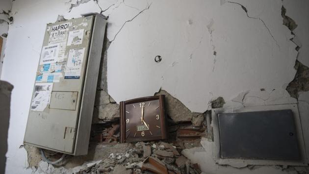 A wall clock that stopped working during the time of the earthquake is seen inside a damaged building in Durres. The first seriously damaged building has been demolished, and a dozen others are expected to follow. Assessment experts from Greece, France, Italy, Hungary, Bulgaria, Lithuania and Latvia are involved. (Petros Giannakouris / AP)