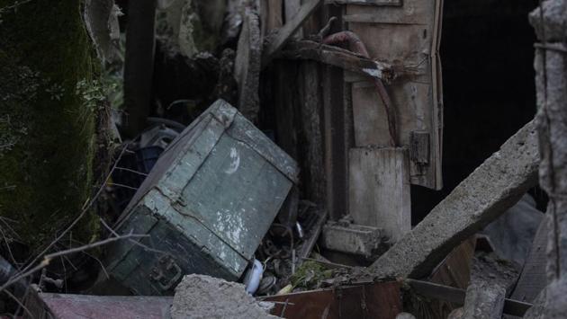 A wooden box stands among debris of a collapsed building in Thumane. The government has set up financial compensations for families of the dead, including 1 million Lek ($9,000) per family, special pensions for elders and scholarships for children. Government and private calls for donations have collected about 15 million euros ($16 million) in three days. (Petros Giannakouris / AP)