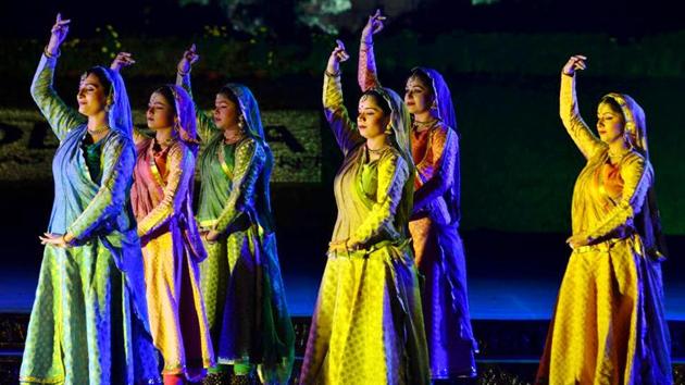 Artists perform during the Konark Festival celebration, in the backdrop of the Sun Temple, in Konark on Sunday. (ANI)