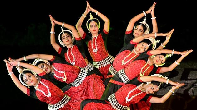 Artists perform during the Konark Festival celebration, in the backdrop of the Sun Temple, in Konark on Sunday. (ANI)