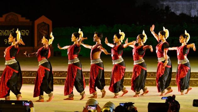Artists perform during the Konark Festival celebration, in the backdrop of the Sun Temple, in Konark on Sunday.