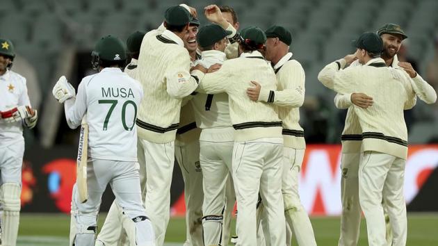 Australia celebrate their win over Pakistan during their cricket test match in Adelaide.(AP)