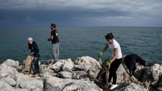 Volunteers clean the shore from plastic waste during a cleaning operation at the port of the Ionian island of Zakynthos. But recycling efforts are still basic. Greece last year eliminated free supermarket bags, long after other European countries. “Recycling in Greece is a joke,” snorts George Sarelakos, the co-founder of Aegean Rebreath. “Every municipality has its own policy, there is no central strategy,” he told AFP. (Louisa Gouliamaki / AFP)