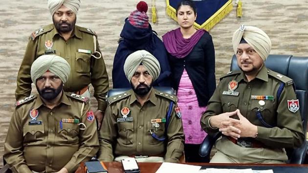 The accused (face covered) in police custody in Ludhiana on Sunday. (HT PHOTO) The accused (face covered) in police custody in Ludhiana on Sunday. (HT PHOTO)
