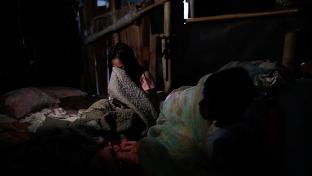 Siblings Cindy, 14, and DJ Martinez, 12, wake up in their bamboo hut. A U.N. climate change summit to be held in Madrid from December 2-13, and with wildfire in the United States and Australia, and severe flooding in Europe all being linked to global warming, public pressure is rising on cost-conscious national governments to find urgent solutions. (Eloisa Lopez / REUTERS)