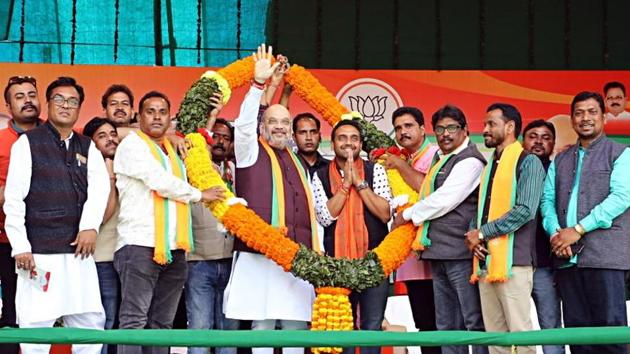 Union Home Minister and BJP National President Amit Shah being felicitated by party workers during an election rally in Baharagora, Jharkhand. (ANI Photo) Union Home Minister and BJP National President Amit Shah being felicitated by party workers during an election rally in Baharagora, Jharkhand. (ANI Photo)