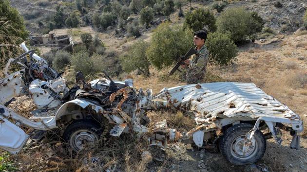 An Afghan security personnel next to a damaged IS-K vehicle. In the years since 2015, IS-K proved resilient and resourceful, using tunnels to shelter from an aerial onslaught that famously included the US deploying the “Mother Of All Bombs” in 2017. US military officials no longer detail IS-K’s force strength, but for years it was estimated between 2,500 and 4,000 fighters. (Noorullah Shirzada / AFP)