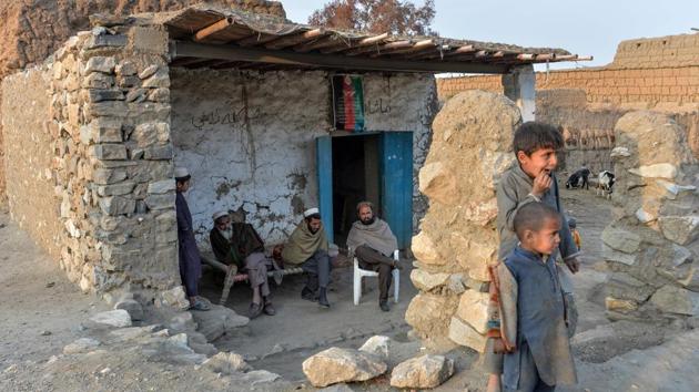 Residents look on after they have returned to their village following four years of fighting between Afghan security forces and IS-K in Achin district. Even though the village now is free of IS-K, it will take time for residents to feel safe, and many are traumatised. “Daesh have planted mines everywhere -- in schools, clinics, people’s homes,” Himatullah said, using the Arabic acronym for IS. (Noorullah Shirzada / AFP)