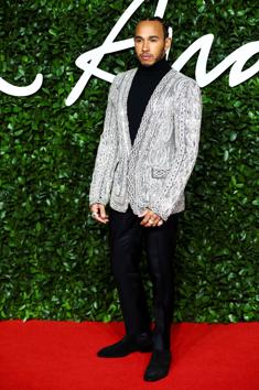 Racing car driver Lewis Hamilton poses as he arrives at the Fashion Awards 2019 in London, Britain December 2, 2019. REUTERS/Lisi Niesner (REUTERS)