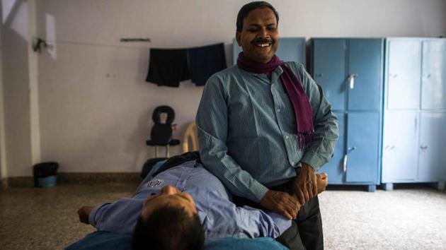 Sharma trained at a school for the blind and landed a job in a factory, making children’s braille toys, for more than two decades before it shut down last year. He started to retrain as a massage therapist in January, resolutely making the long commute to classes at the Blind Relief Association in Delhi. (Xavier Galiana / AFP)
