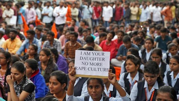 A woman holds a placard during a protest against the alleged rape and murder of a 27-year-old woman in Hyderabad. (REUTERS) A woman holds a placard during a protest against the alleged rape and murder of a 27-year-old woman in Hyderabad. (REUTERS)