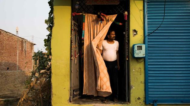 Vinod Kumar Sharma, 44, a visually impaired person stands at the entrance of his home in Asaoti, Haryana. Tapping his white cane, Vinod Kumar Sharma spends four hours a day running the gauntlet of crowded trains and New Delhi’s congested, potholed and often pavement-less roads. (Xavier Galiana / AFP) Vinod Kumar Sharma, 44, a visually impaired person stands at the entrance of his home in Asaoti, Haryana. Tapping his white cane, Vinod Kumar Sharma spends four hours a day running the gauntlet of crowded trains and New Delhi’s congested, potholed and often pavement-less roads. (Xavier Galiana / AFP)