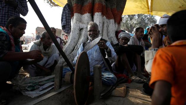 A blacksmith sharpens a blade ahead of the ceremony. The mass sacrifice is said to be the cruellest form of animal slaughtering in public religious places, according to the International Organisation for Animal Protection (IOAP). Millions of animals are hijacked in a ground with few peoples carrying blunt blades and chase them to slit and behead with several attempts leading to slow and hard death, it said. (Navesh Chitrakar / REUTERS)