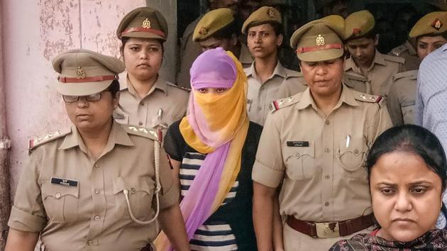 The woman law student (face covered), who alleged BJP leader Chinmayanand of sexual misconduct and harassment, is seen outside a government hospital after a medical examination, in Shahjahanpur in September. (File photo: PTI) The woman law student (face covered), who alleged BJP leader Chinmayanand of sexual misconduct and harassment, is seen outside a government hospital after a medical examination, in Shahjahanpur in September. (File photo: PTI)