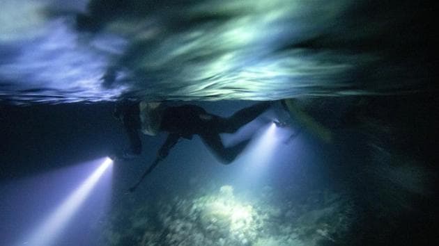 AP Photos: Night fishing in moonlit sea in eerie silence