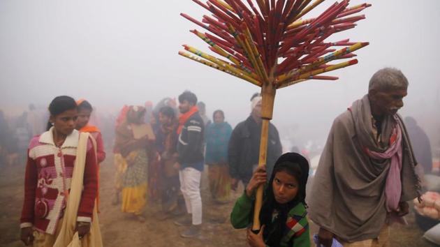 A girl waits for customers as she sells flutes at the Gadhimai Mela. “We didn’t ask the people to bring animals for slaughter,” said Ramchandra Sah Teli, chair of Gadhimai Temple Management Committee. “They came on their own. It’s an age-old tradition that they adhere to and it is what makes the festival so popular,” he explained. (Navesh Chitrakar / REUTERS)