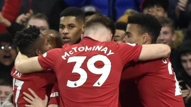 Players celebrate after Manchester United's Marcus Rashford scored his side's opening goal.(AP)