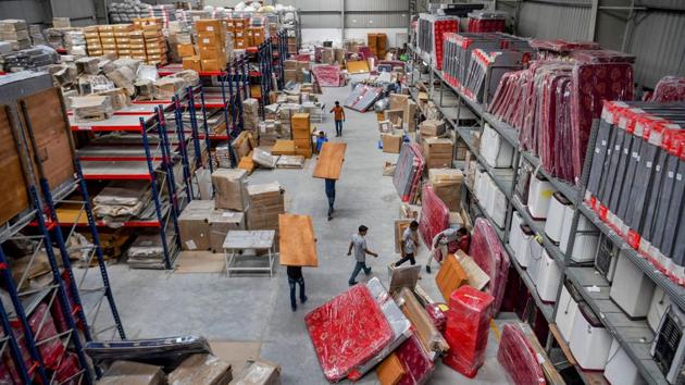 Workers sort products prior to their dispatch to customers at a warehouse of online furniture and appliance rental company, in Bangalore. “My parents don’t understand the concept of renting furniture at all. They have never been completely on-board with the idea,” Sharma said. “They said it would be much better to buy rather than rent furniture in the long term.” (Manjunath Kiran / AFP)